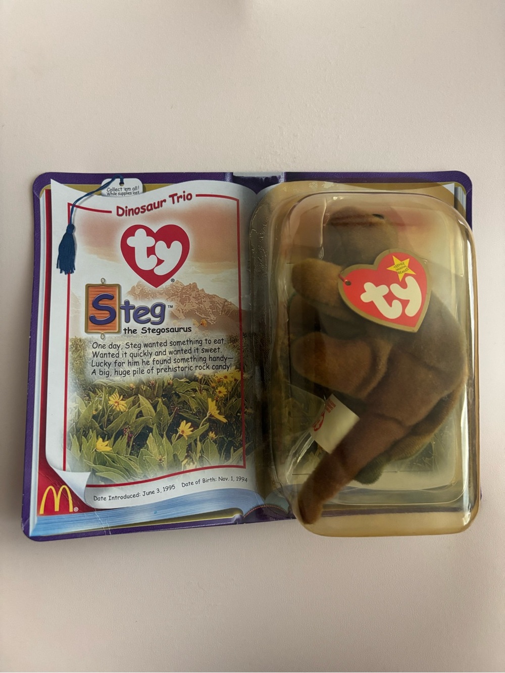 Vintage 2000s Ty Steg the Stegosaurus Teenie Beanie baby from McDonalds.